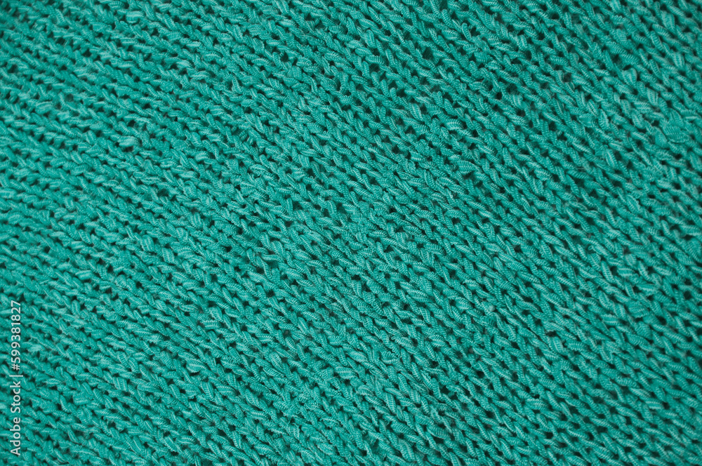 blue unusual texture.knitted turquoise sweater close up. handmade concept blue unusual texture.knitted turquoise sweater close up. handmade concept