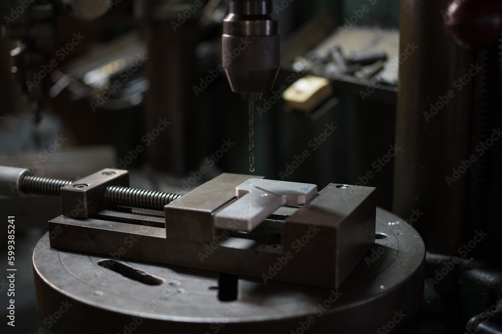 Part machining with drilling machine