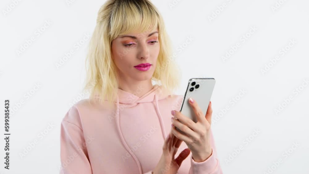 Woman, mobile cell phone, say Yes and celebration for winning, discount or sale on white studio background. Excited female lady with smartphone for social media, online streaming, news and internet Woman, mobile cell phone, say Yes and celebration for winning, discount or sale on white studio background. Excited female lady with smartphone for social media, online streaming, news and internet