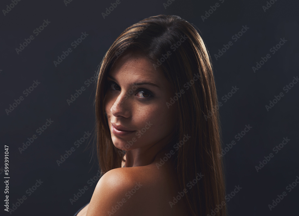 Coy yet flirty. A cropped shot of an attractive young brunette isolated on a black background. Coy yet flirty. A cropped shot of an attractive young brunette isolated on a black background.