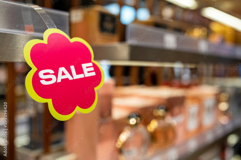 Sale signs - shopping concept background. Sale sign on shelf in supermarket with copy space, business concept, selective focus. - obrazy, fototapety, plakaty 