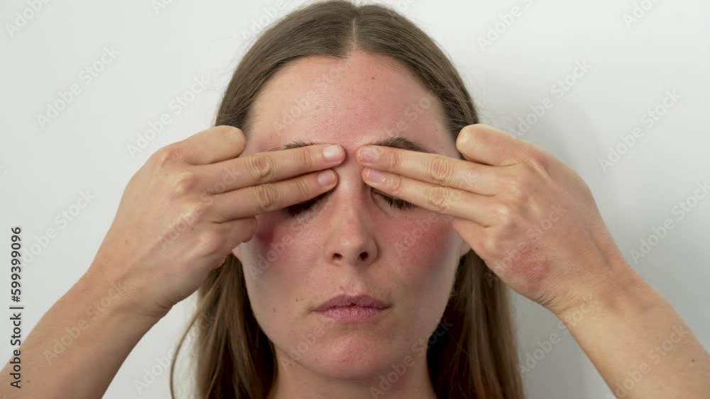 caucasian young woman practicing face yoga with hands on eye contours and eyebrows close up caucasian young woman practicing face yoga with hands on eye contours and eyebrows close up
