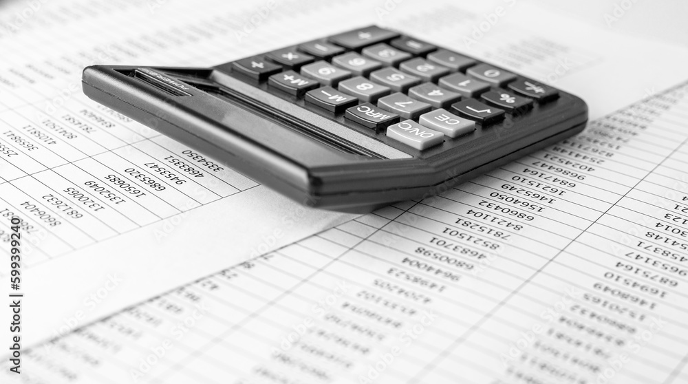 Calculator on financial statement and balance sheeet on desk of auditor. Concept of accounting and audit business. Calculator on financial statement and balance sheeet on desk of auditor. Concept of accounting and audit business.