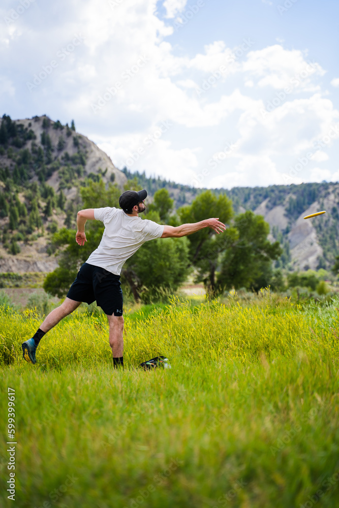 Man playing disc golf Man playing disc golf
