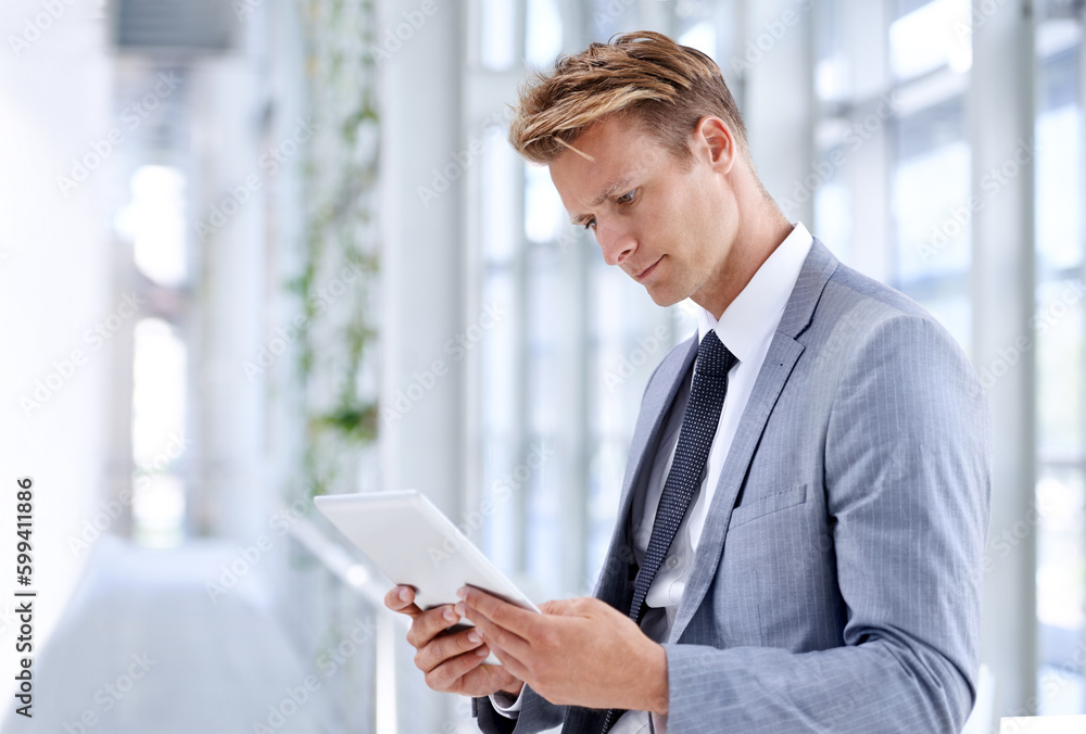 He has a drive for business. A young businessman standing in the workplace.