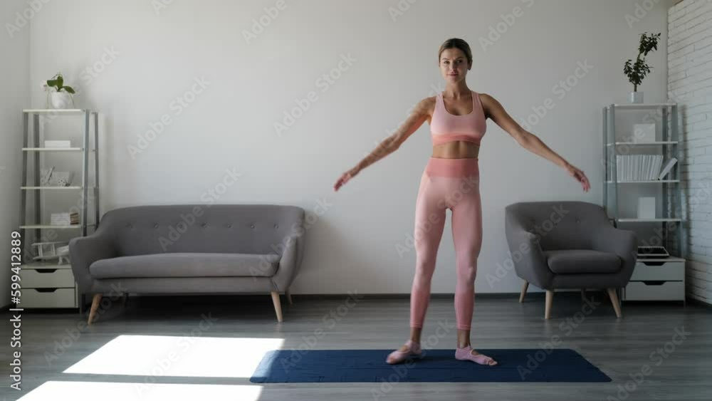 Full body young sporty fitness woman workout at home. Fitness, sport, training and lifestyle concept. Smiling woman in sportswear stretching on mat. Full body young sporty fitness woman workout at home. Fitness, sport, training and lifestyle concept. Smiling woman in sportswear stretching on mat.