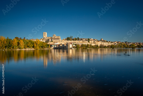 Beautiful Long Exposure panoramic view of Zamora cityscape during Autumn season, from the other side of the Douro River, in Spain.