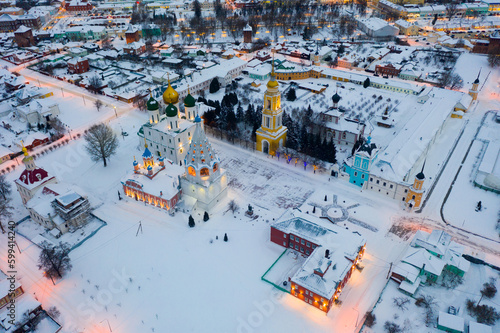 Scenic view from drone of Kolomna cityscape with architectural ensemble of ancient Kremlin during sunset in winter, Russia