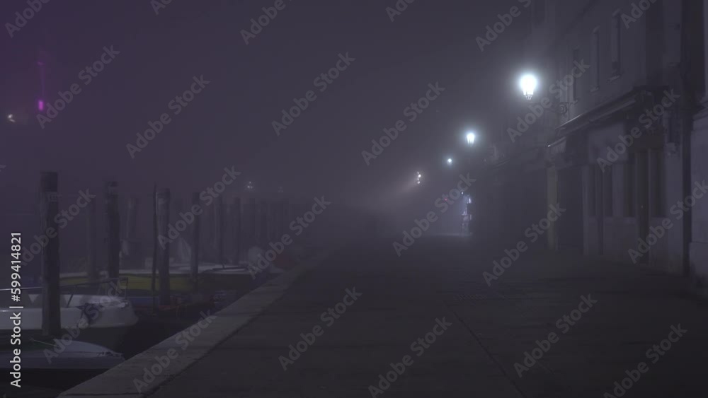 Motion along foggy embankment with moored boats at night Motion along foggy embankment with moored boats at night