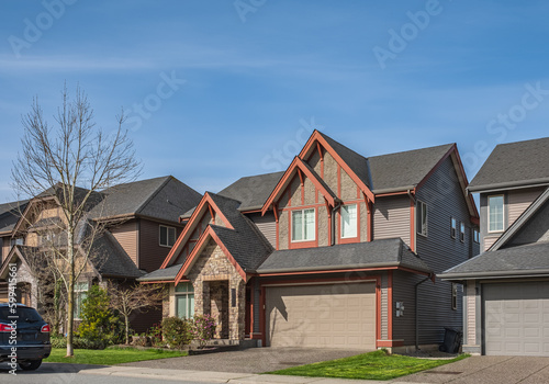 Perfect neighborhood. Houses in suburb at Spring in the north America. Real Estate Exterior Front Houses on a sunny day