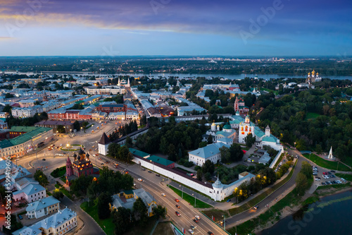 Summer evening view from drone of Russian city of Yaroslavl on banks of Volga with ancient Spaso-Preobrazhensky monastery at dusk.
