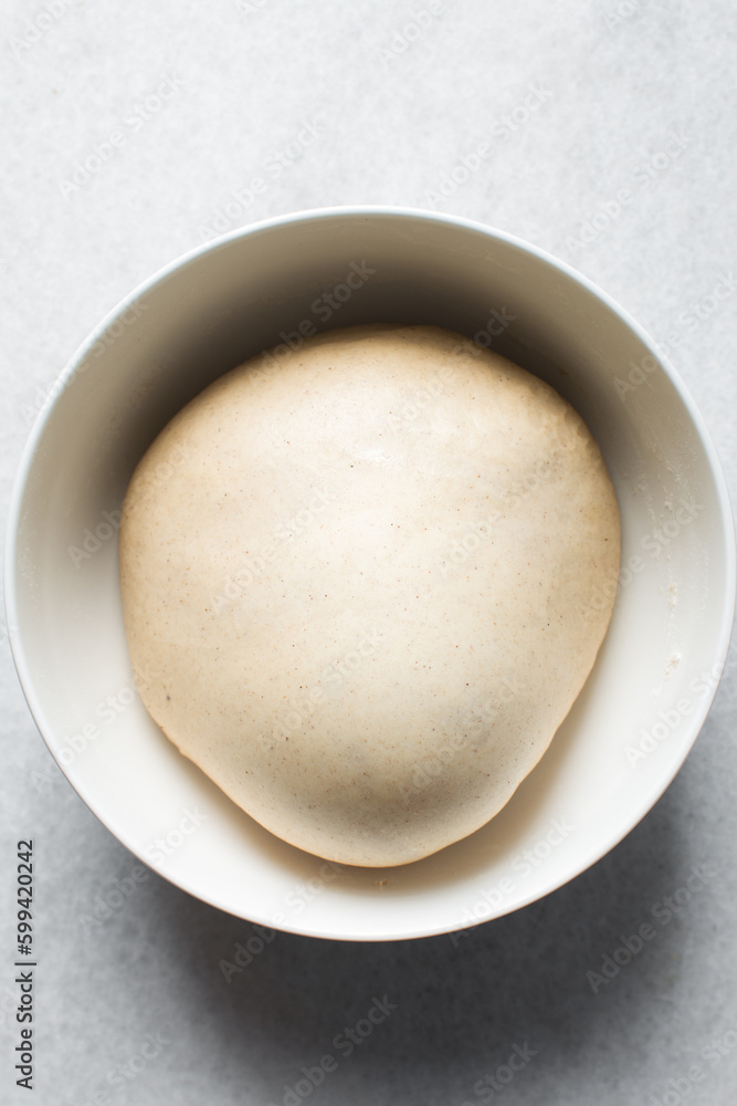 Bread dough that has doubled in size, dough that has risen, proofed dough in a bowl Bread dough that has doubled in size, dough that has risen, proofed dough in a bowl