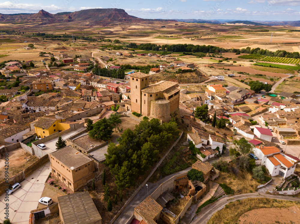 View from drone of Spanish village Cervera de la Canada and church of Santa Tecla, part of the UNESCO World Heritage Site