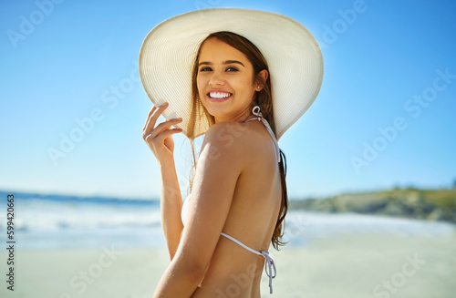 Mondays would be better at the beach. Closeup shot of a beautiful young woman spending some time at the beach.