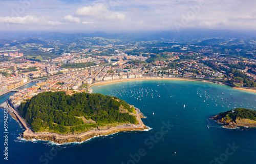 Fototapeta Naklejka Na Ścianę i Meble -  Aerial panoramic view of summer seascape with La Concha Bay and coastal city of San Sebastian, Basque Country, Spain..
