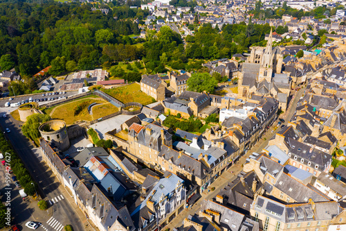Scenic drone view of summer cityscape of Guingamp with Gothic Basilica of Notre Dame de Bon Secours and medieval castle walls  France