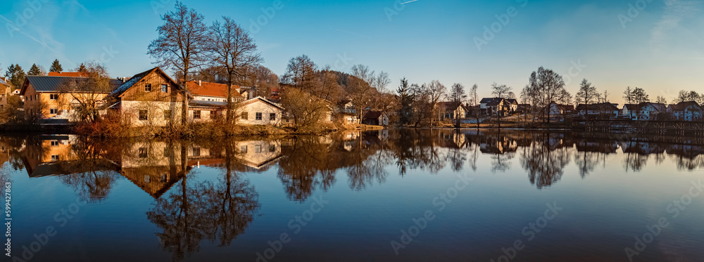 Winter landscape on a sunny day with reflections in a pond near Wiesenfelden, Bavarian forest, Straubing-Bogen, Bavaria, Germany