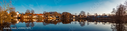 Winter landscape on a sunny day with reflections in a pond near Wiesenfelden, Bavarian forest, Straubing-Bogen, Bavaria, Germany © Martin Erdniss