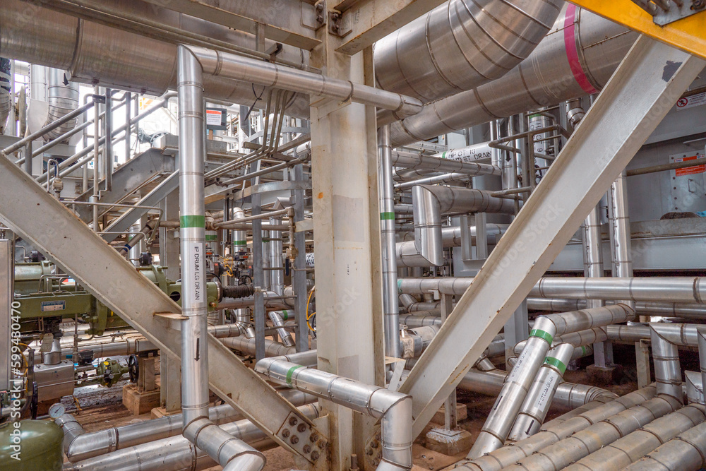 Heat recovery Steam Generator with pipe line, air intake and Up stair. The photo is suitable to use for industry background photography, power plant poster and electricity content media. Heat recovery Steam Generator with pipe line, air intake and Up stair. The photo is suitable to use for industry background photography, power plant poster and electricity content media.