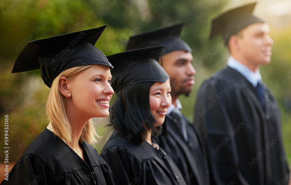 Ready for the next challenge. a group of young college graduates standing in a row. Ready for the next challenge. a group of young college graduates standing in a row.