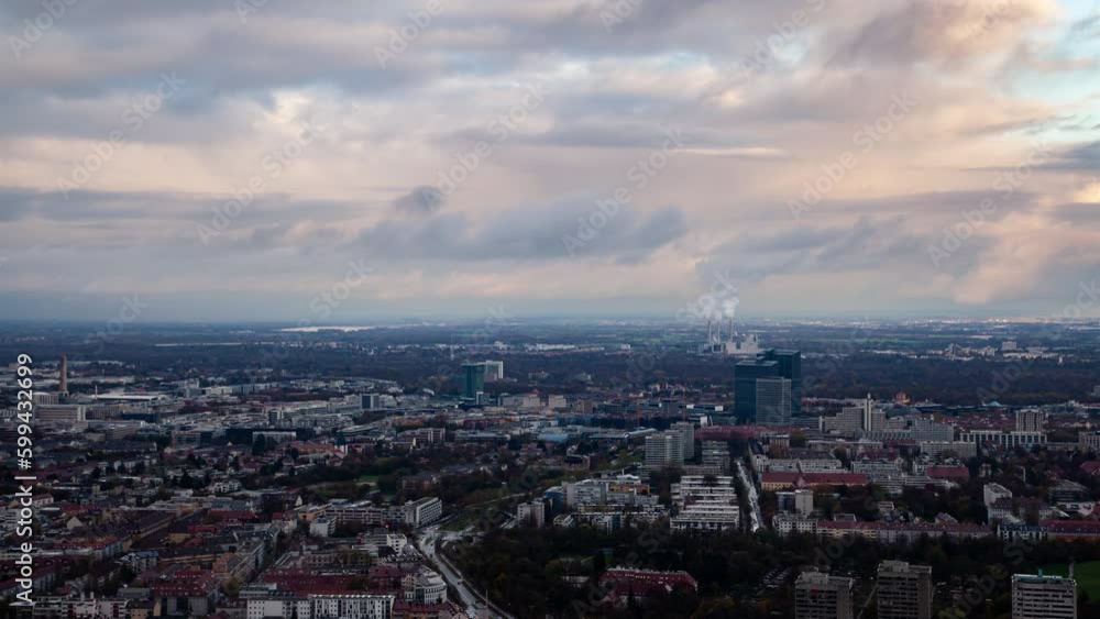 Stunning aerial timelapse of Munich's cityscape in autumn, showcasing the skyline, architecture, and clouds moving over urban areas. Stunning aerial timelapse of Munich's cityscape in autumn, showcasing the skyline, architecture, and clouds moving over urban areas.