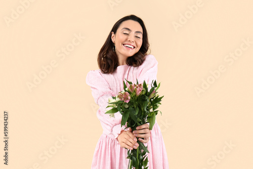 Young woman in pink dress w...