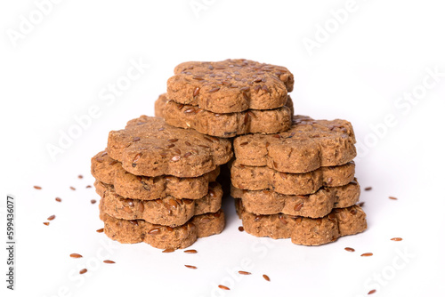 Fresh cookies with dried plums and caraway seeds on the white background