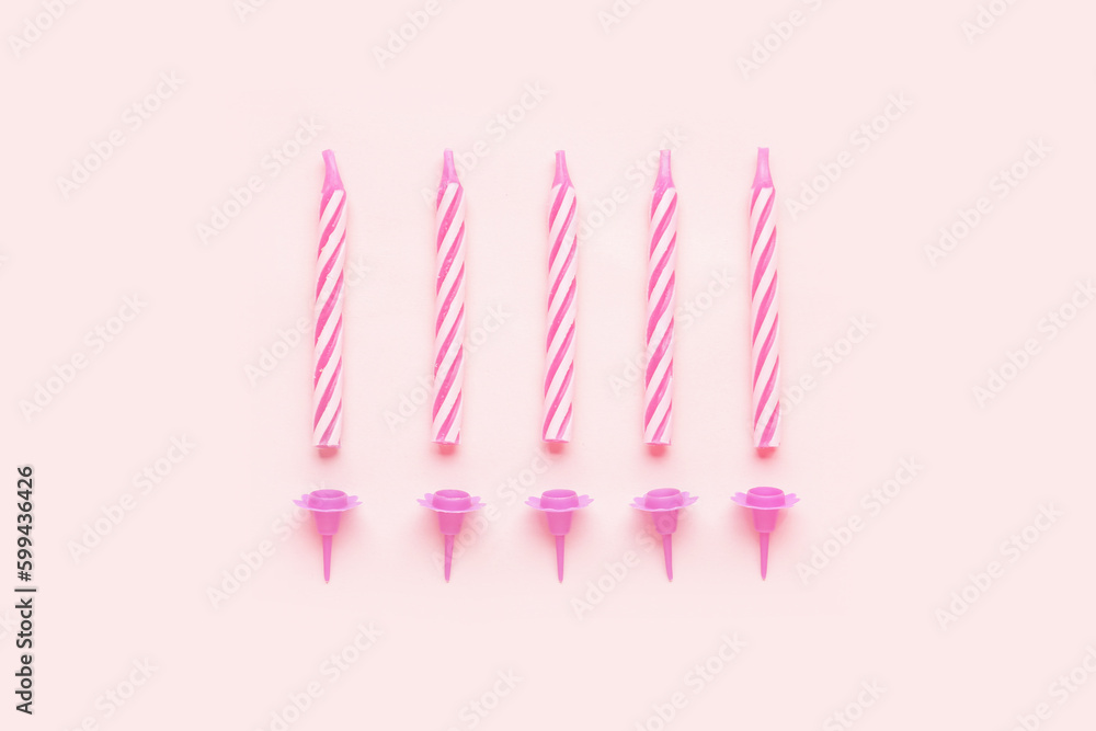 Birthday candles on pink background