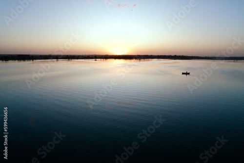 Laguna Atardecer canoa sol