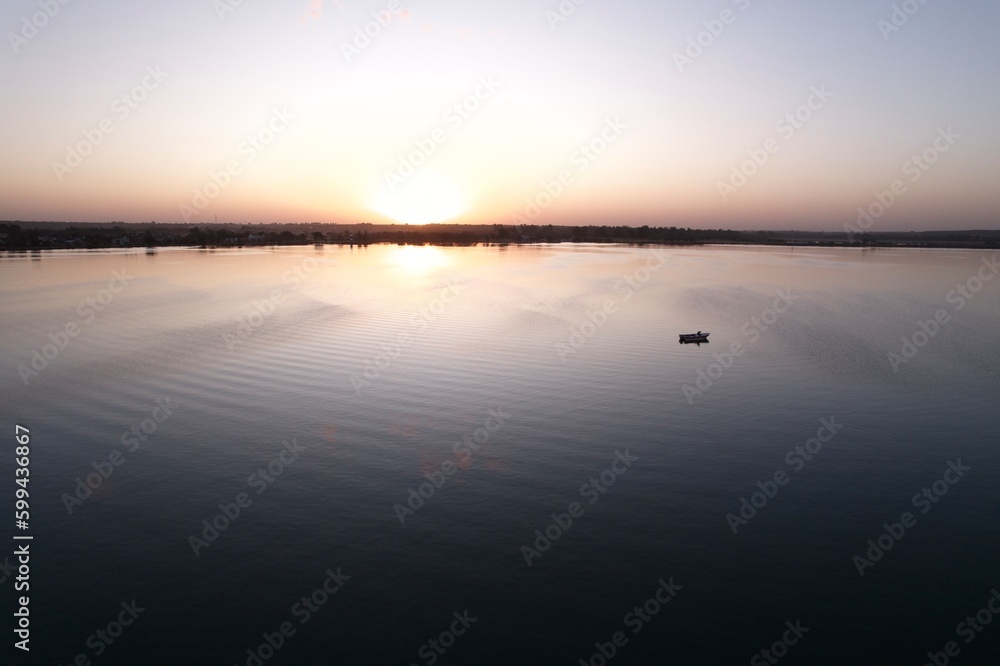 Laguna Atardecer canoa sol