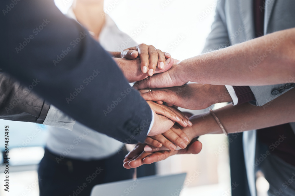 Their hard work really adds up. a group of unrecognizable businesspeople piling their hands on top of each other in the office. Their hard work really adds up. a group of unrecognizable businesspeople piling their hands on top of each other in the office.