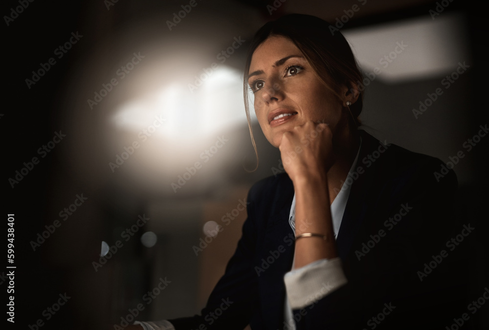 © Angelo/peopleimages.com - Success is built on day to day dedication. a young businesswoman working online during a late night in a modern office.