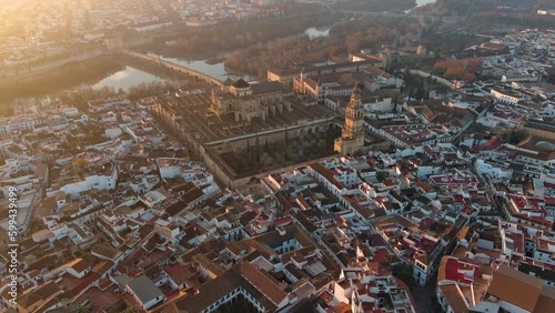 A view from above of the Mosque-Cathedral of Cordoba and the Roman bridge across the Guadalquivir River, both located in Andalusia, Spain and part of a UNESCO World Heritage Site