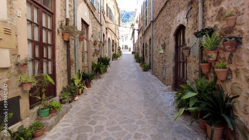 Narrow Street in Valdemossa with green plants, Mallorca