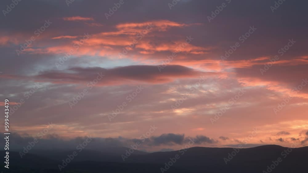 Blue And Pink Sunrise, Sunset Clouds, with Mountains Blue And Pink Sunrise, Sunset Clouds, with Mountains