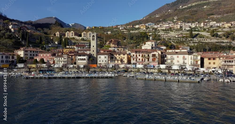 Aerial drone sideways over Fenaroli tower in Tavernola Bergamasca over Iseo lake, Italy Aerial drone sideways over Fenaroli tower in Tavernola Bergamasca over Iseo lake, Italy