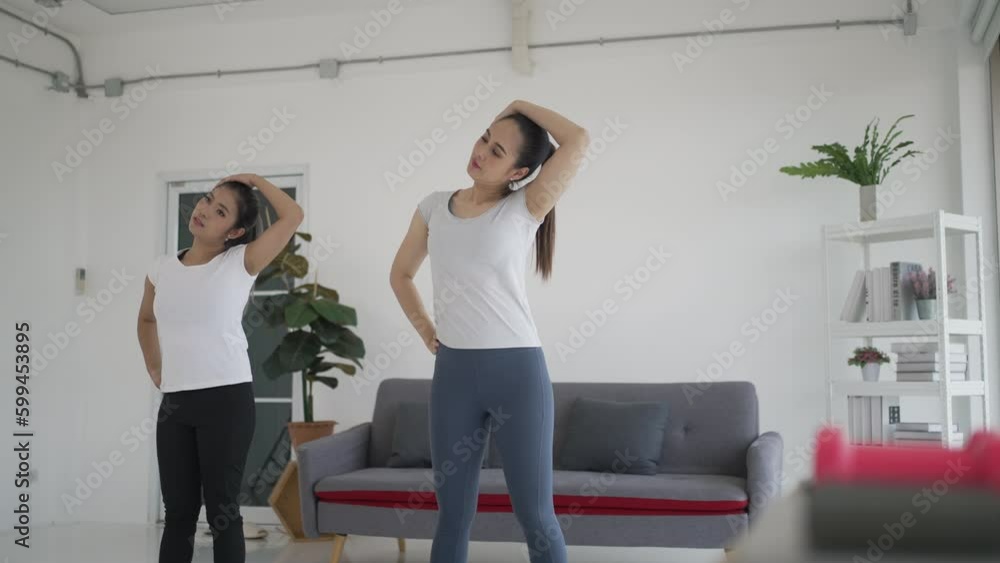 Women play yoga at home. Women play yoga at home.