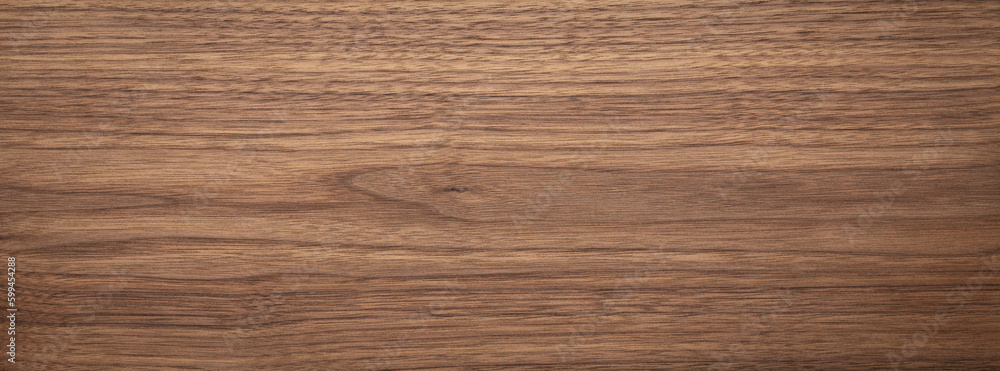 Natural walnut grain with beautiful wood grain. Walnut long planks texture. Walnut wood texture background. Natural walnut grain with beautiful wood grain. Walnut long planks texture. Walnut wood texture background.