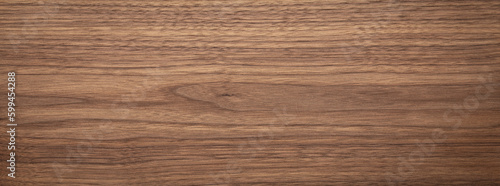 Natural walnut grain with beautiful wood grain. Walnut long planks texture. Walnut wood texture background.