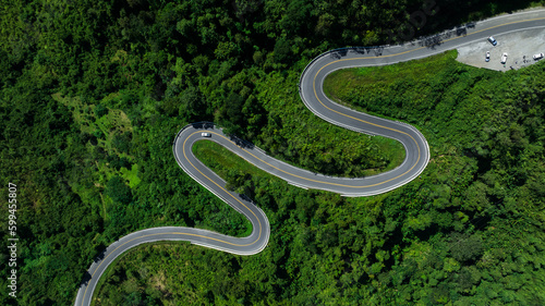 aerial view ROAD No.1081 or shape number three of winding mountain road between Pua District, Nan Province, Thailand is highlight point and landmark that tourist like to take pictures  photo