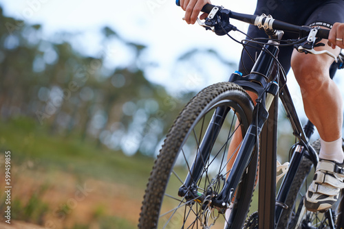 Mountain biking is addictive. Cropped view of a cyclist exploring outdoor terrain on his bike.