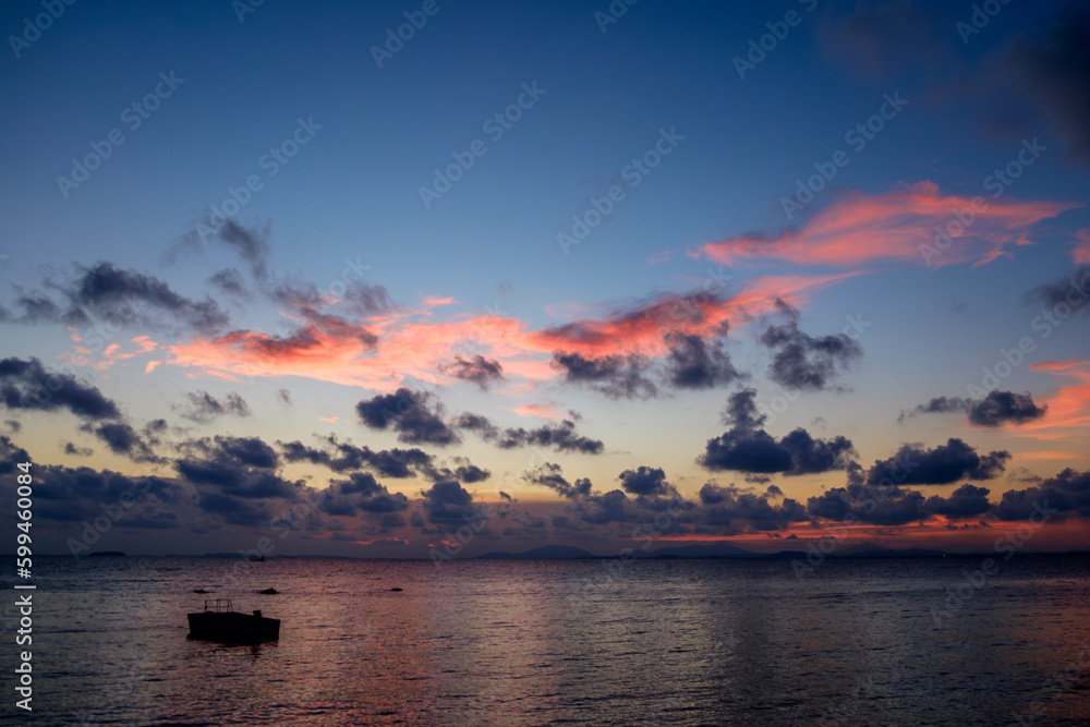 Late Evening Sunset on Thai Beach with light shine through the clouds. no tide