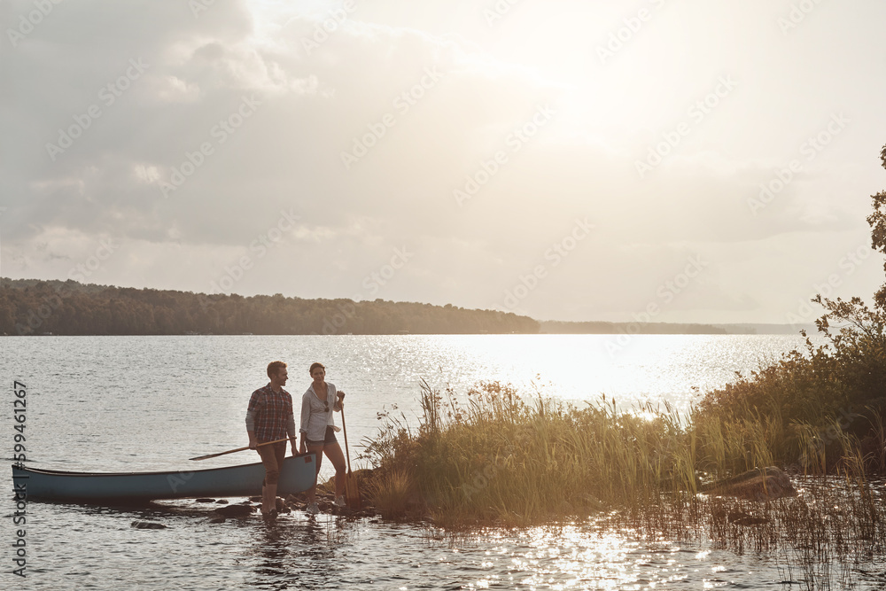 Their dream dates involve being outdoors. a young couple going for a canoe ride on the lake. Their dream dates involve being outdoors. a young couple going for a canoe ride on the lake.