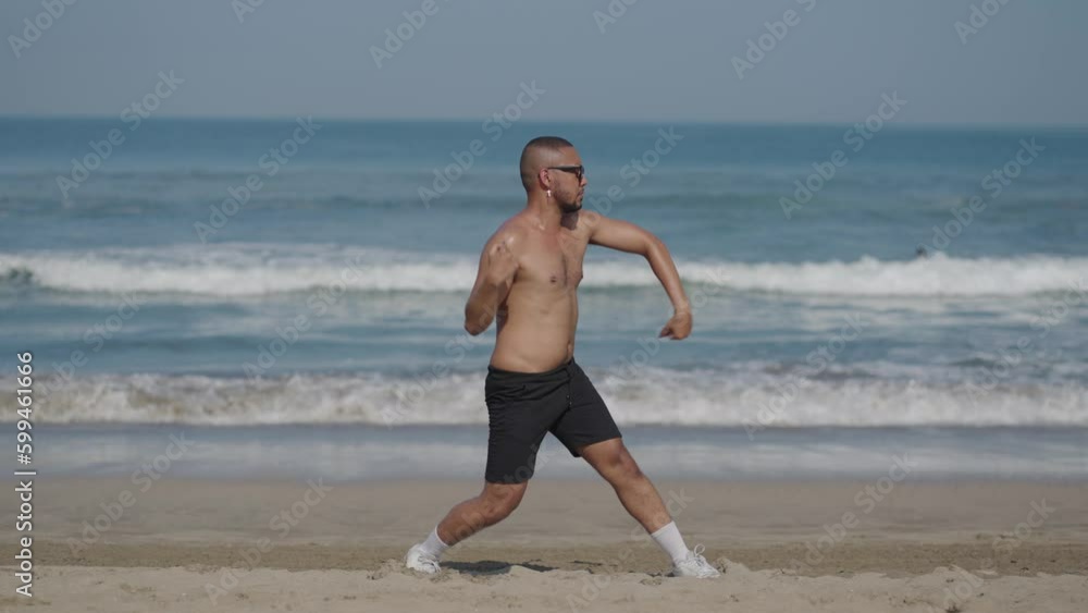 Handsome LGBT Queer Gay Man Male Dancer Dance on the Beach with Confidence Topless on a Blue Sunny Day Handsome LGBT Queer Gay Man Male Dancer Dance on the Beach with Confidence Topless on a Blue Sunny Day
