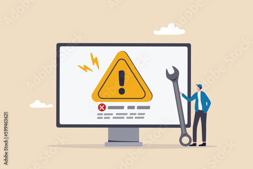 System error, software problem or system failure, security alert or hardware fault to be fixed, caution or maintenance concept, young technician holding wrench fix system failure message on computer.