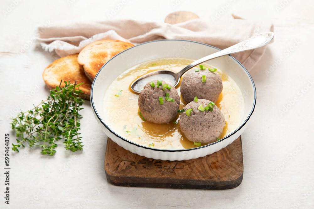 Knodel soup bowl and bread. Knodel soup bowl and bread.