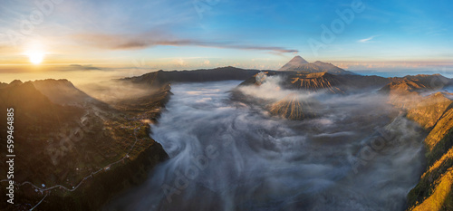 Panoramic view of Mount Bromo and Cemoro Lawang village, Bromo Tengger Semeru national park, Java, Indonesia 2023. Nature landscape background. Southeast Asia