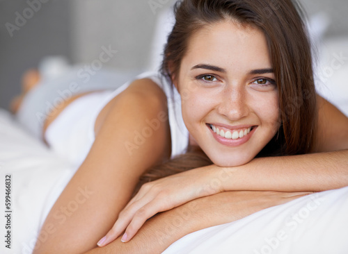 Now this is bliss. Portrait of a beautiful young woman lying in bed. © Yuri Arcurs/peopleimages.com