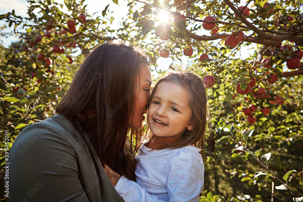 Momma loves you. a happy mother and daughter spending a day together in an apple orchard.