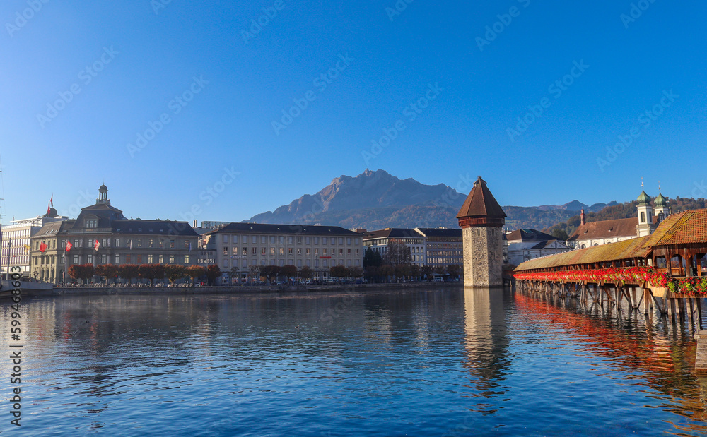 Chapel wooden bridge(240meters long) over the river Reuss of the city of Lucerne in central Switzerland is the oldest wooden bridge in Europe. And the Jesuit Church in Lucerne Central.